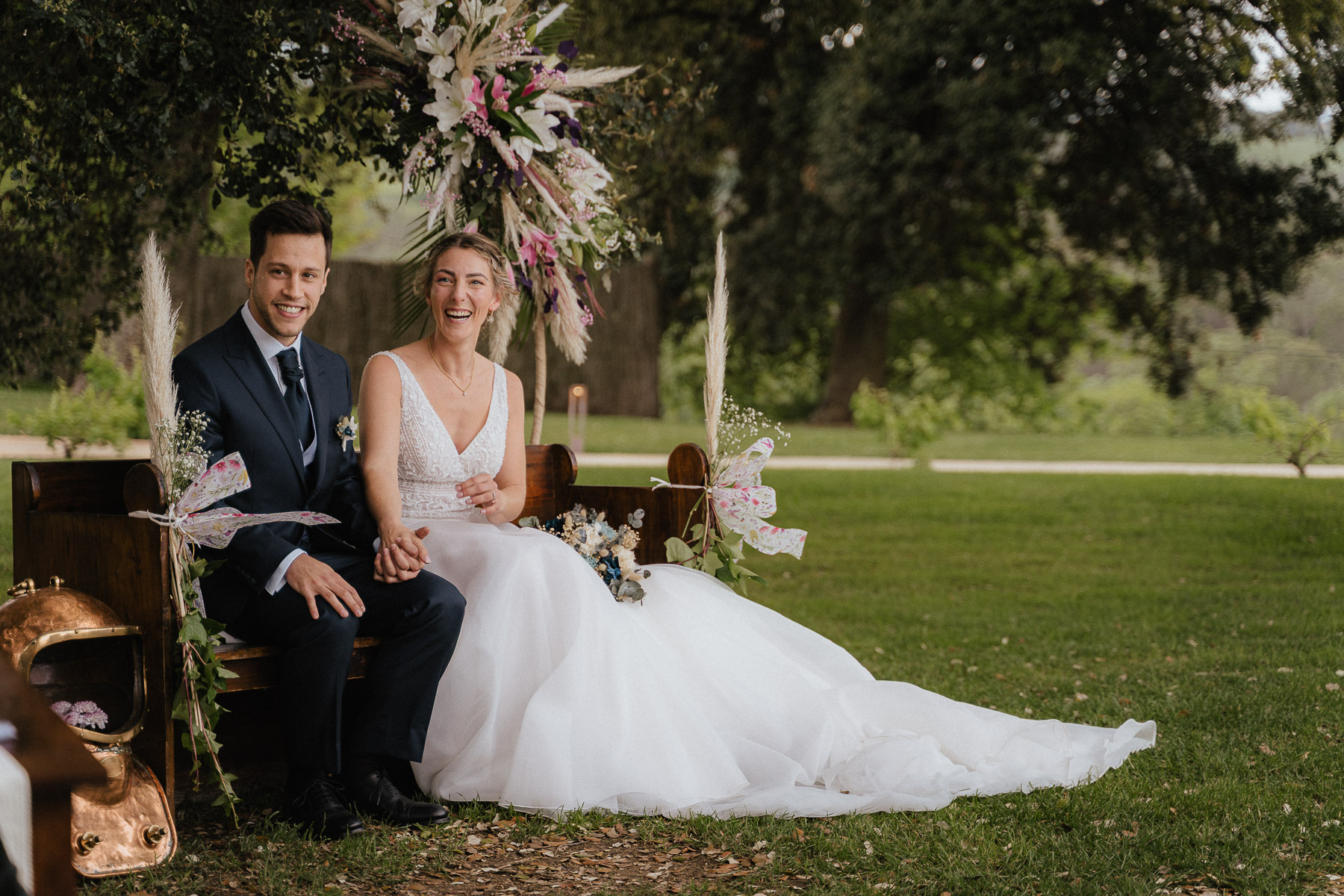 Bride and groom during the wedding ceremony in the beautiful garden at Mas Geroni in Girona